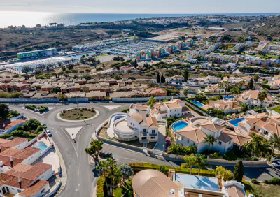 An orange painted blue, cut in half laying on a blue background